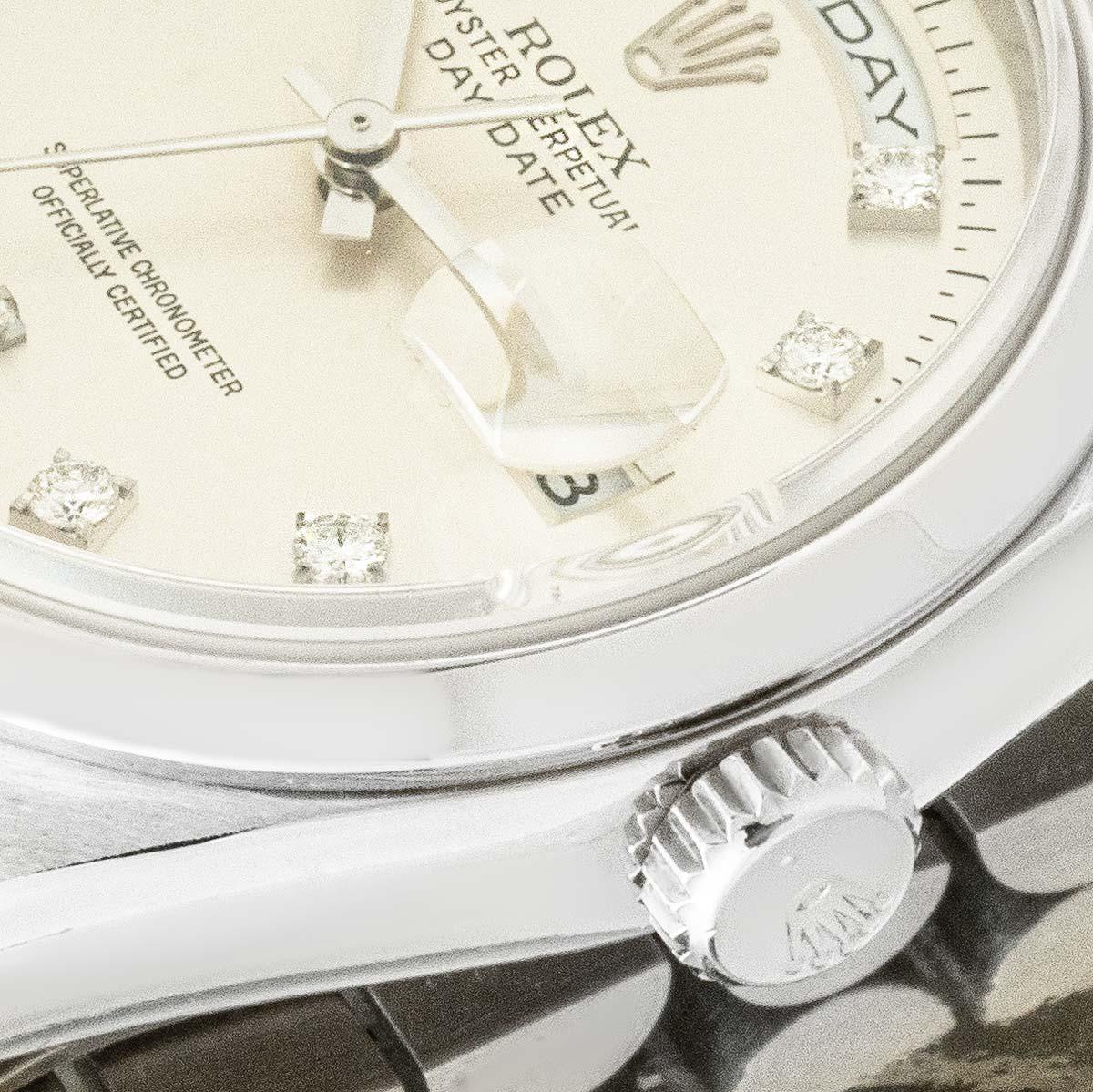 A Rolex platinum Day-Date, reference 118206, with a 36mm case. The silver dial with a weekday and date aperture, is set with 2 baguette cut and 8 round brilliant-cut diamond hour markers. Complementing the dial is a smooth bezel, a president