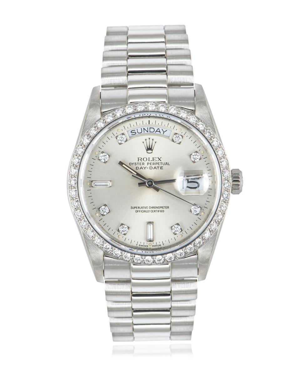 A rare 36mm Day-Date in platinum by Rolex with a single-quick movement. Only a few of these were in production before the introduction of the 18346.

Featuring a silver dial set with 2 baguette-cut and 8 round brilliant cut diamond hour markers with