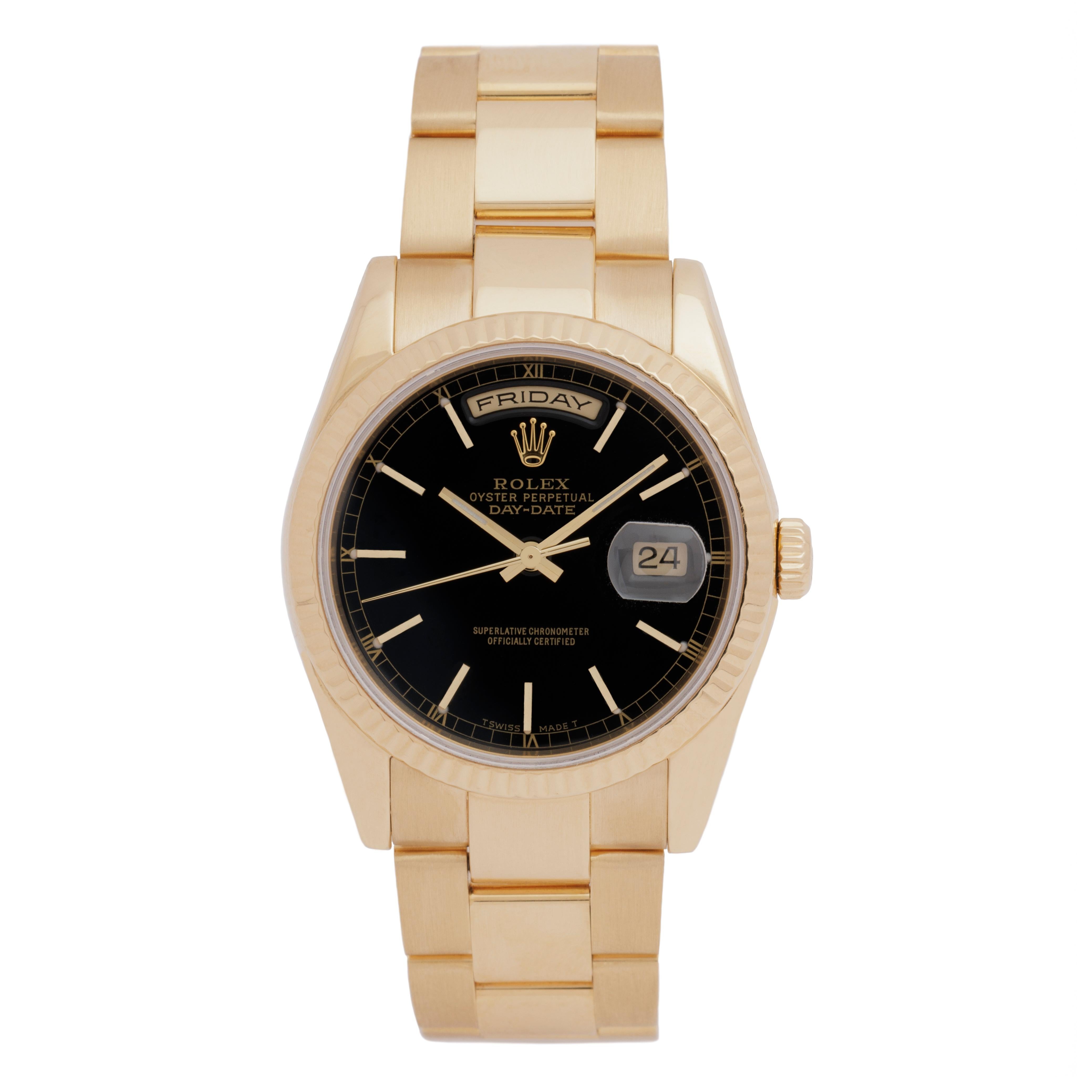 Rolex Day-Date President 118238
36mm
Black Dial - Gold Stick Markers  
18 Karat Yellow Gold 
Automatic Movement
with Original Box
c.2000

The 1986 Rolex Day-Date President is the crown jewel of the Rolex catalog. Debuting in 1956,
the Day-Date is