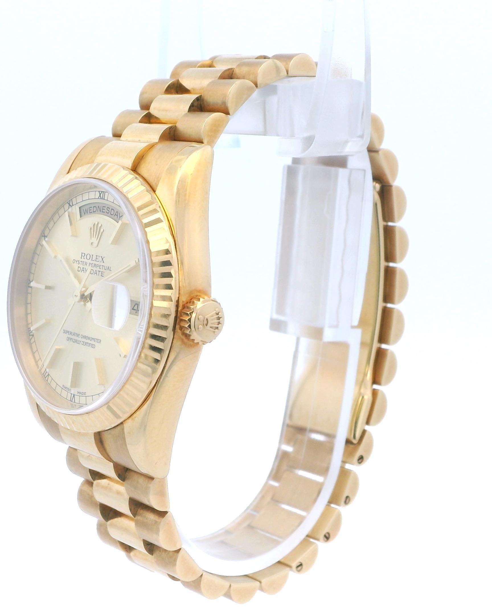 Rolex Day-Date President 118238 Mens Watch. 36mm 18K yellow gold case with 18K yellow gold fluted bezel. Champagne dial with gold hands and gold index hour markers. Minute markers around the outer dial. Date display at the 3 o'clock position and a