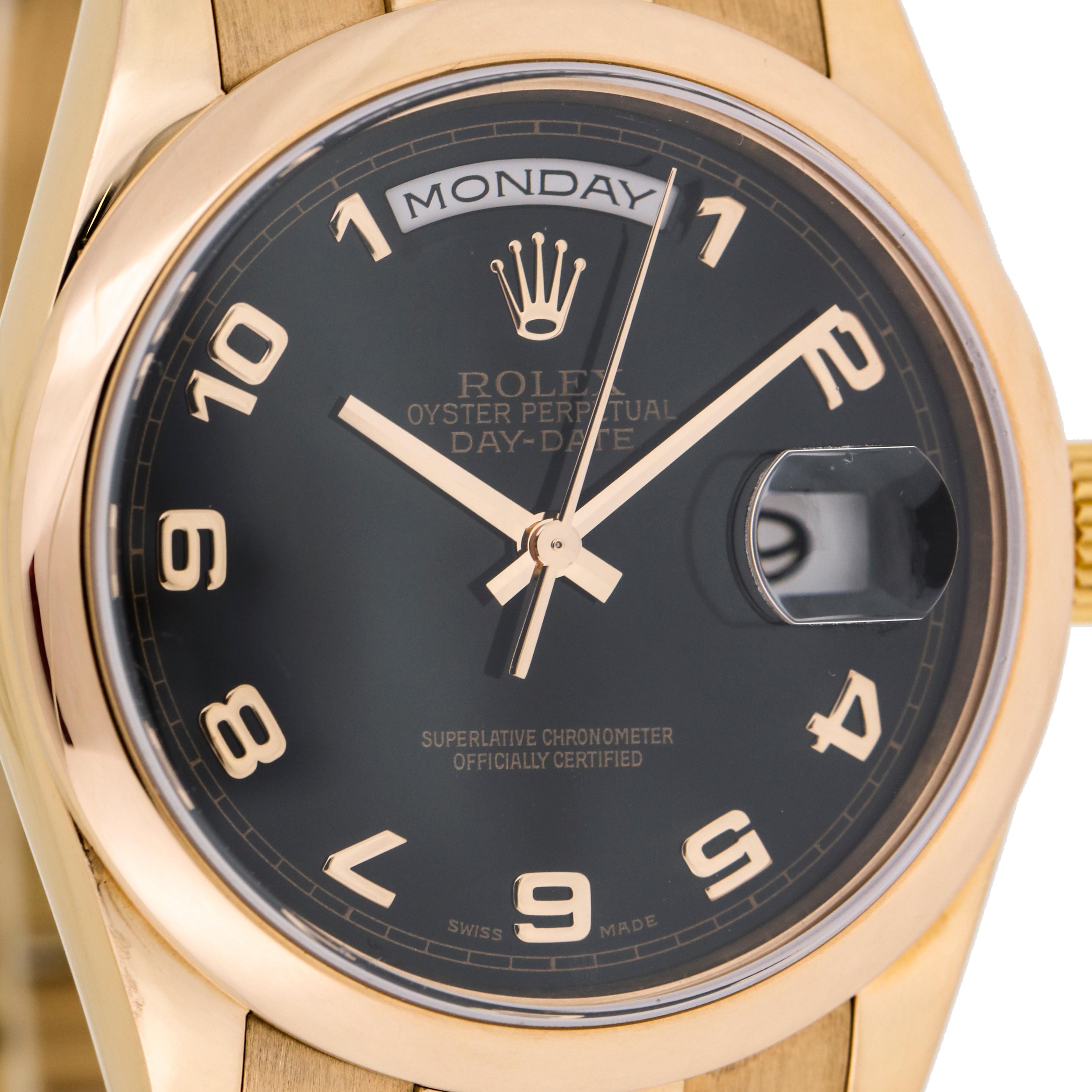 Men's Rolex Day-Date watch with president bracelet and dome bezel in 18-karat Everose gold. Black dial with Arabic numeral hour markers. Screw down crown and case back. Deployment Buckle. Swiss Made. 

Case Size, 36mm
Bracelet Length, 7.5