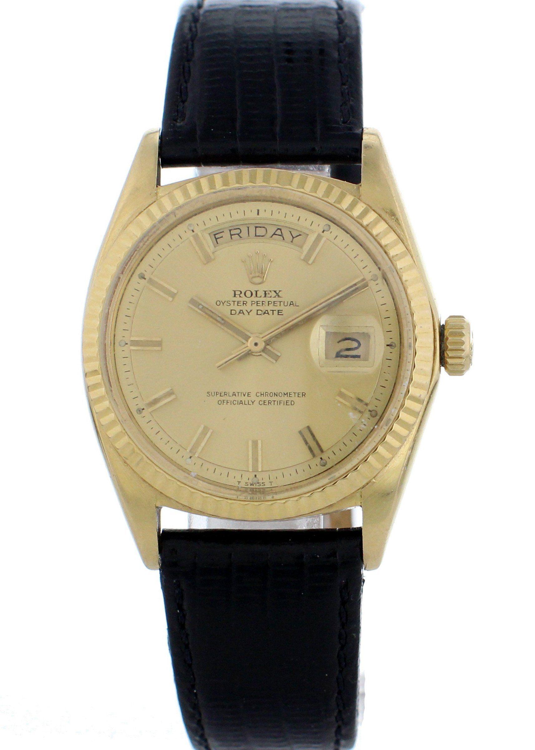 Vintage Rolex Oyster Perpetual Day-Date President 1803. 18K Yellow gold 36mm case with a yellow gold fluted bezel. Champagne dial with gold hands and stick markers. Day and date aperture. Black crocodile grain calfskin strap. Caliber 1556 automatic