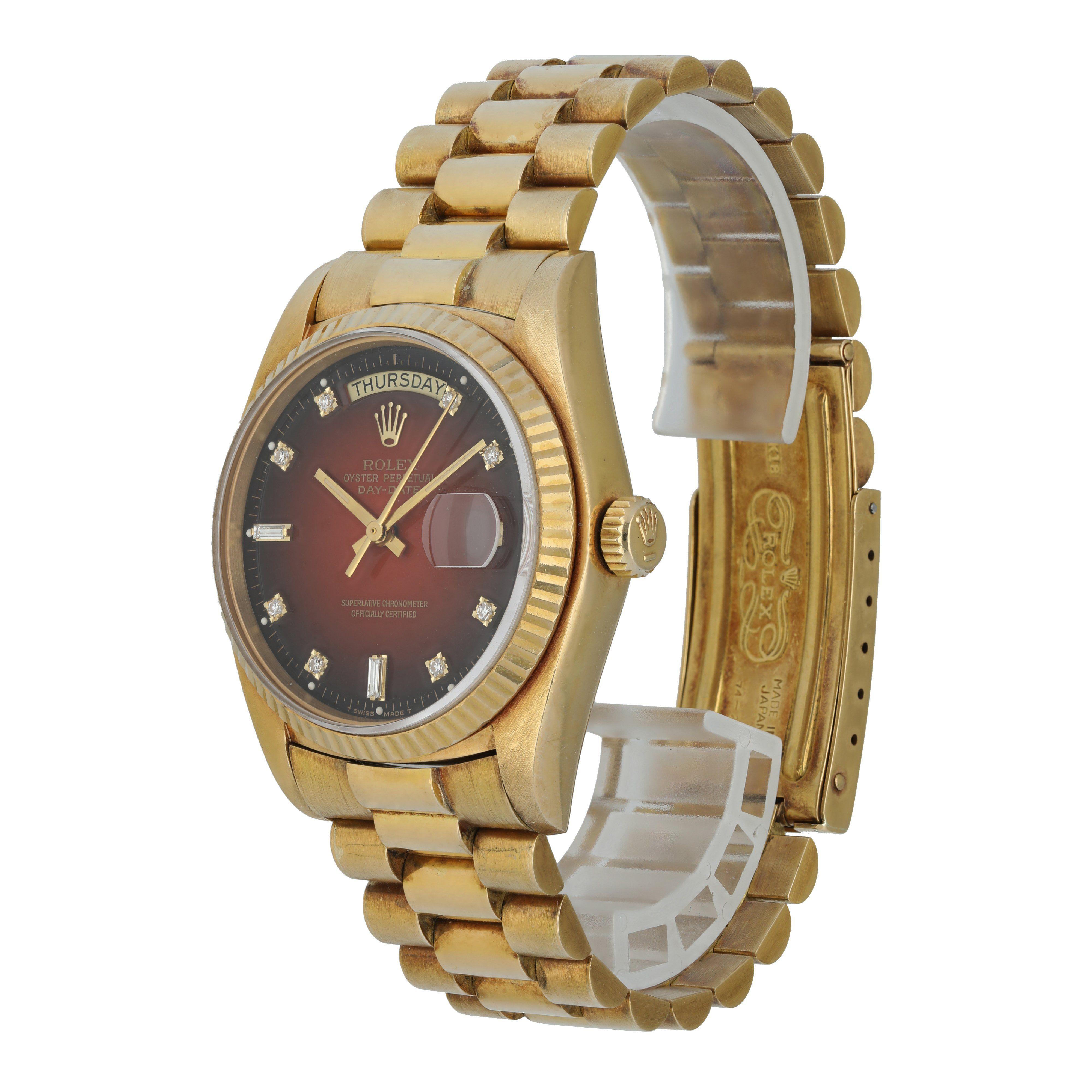 Rolex Day-Date President 18038 men's Watch.
36mm yellow gold case with stationary fluted bezel.
Red Vignette Diamond Dial with gold hands and factory set diamond hour markers.
Date display at the 3 o'clock position.
Day display at the 12 o'clock