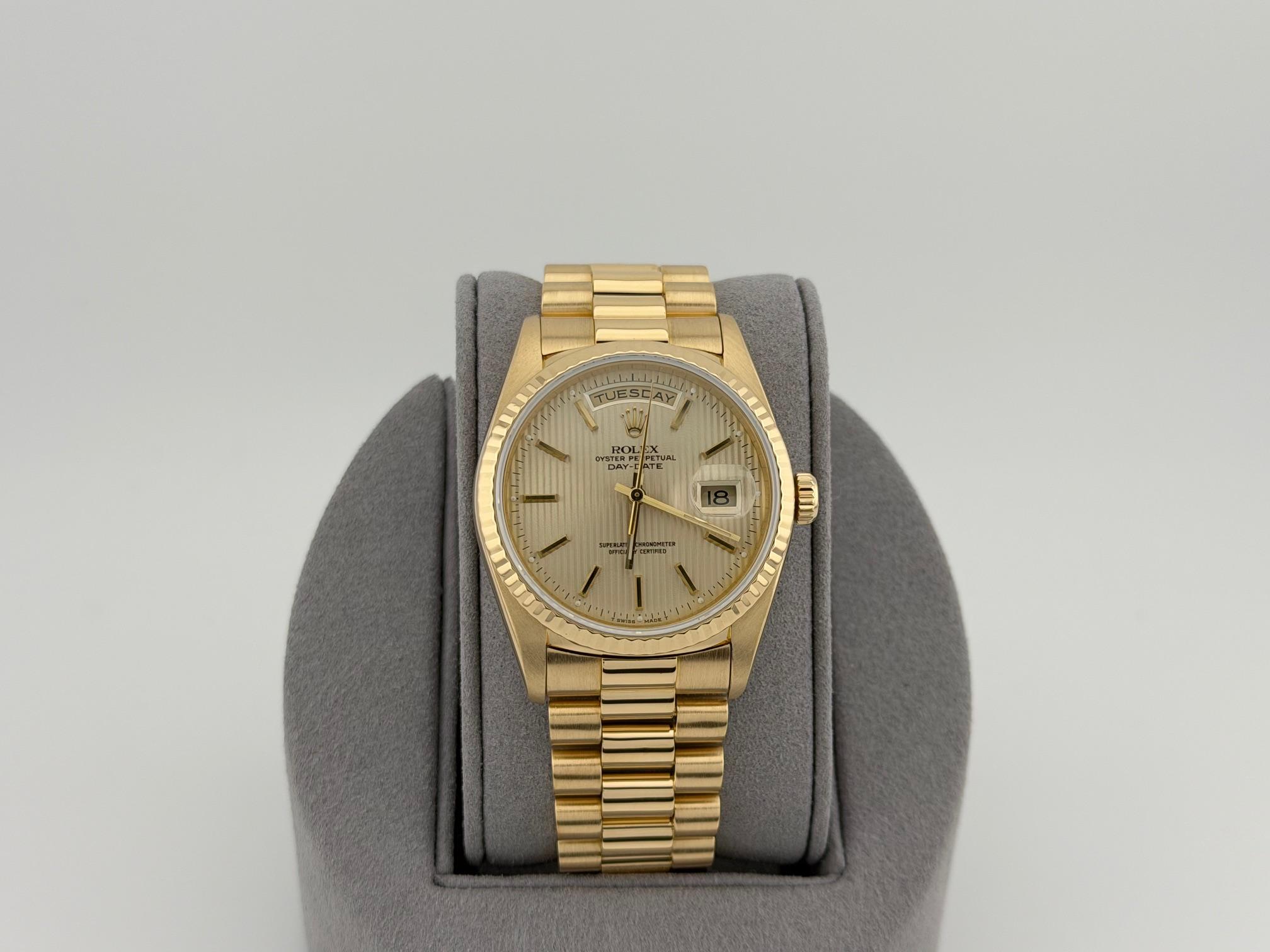 Style Number: 18238



Serial: E19****



Year: 1990

 

Model: Rolex Day Date President

 

Case Material: 18k Yellow Gold 

 

Band: 18k Yellow Gold President

  

Bezel: 18k Yellow Gold Fluted 

  

Dial: Champagne Tapestry Dial

 

Crystal: