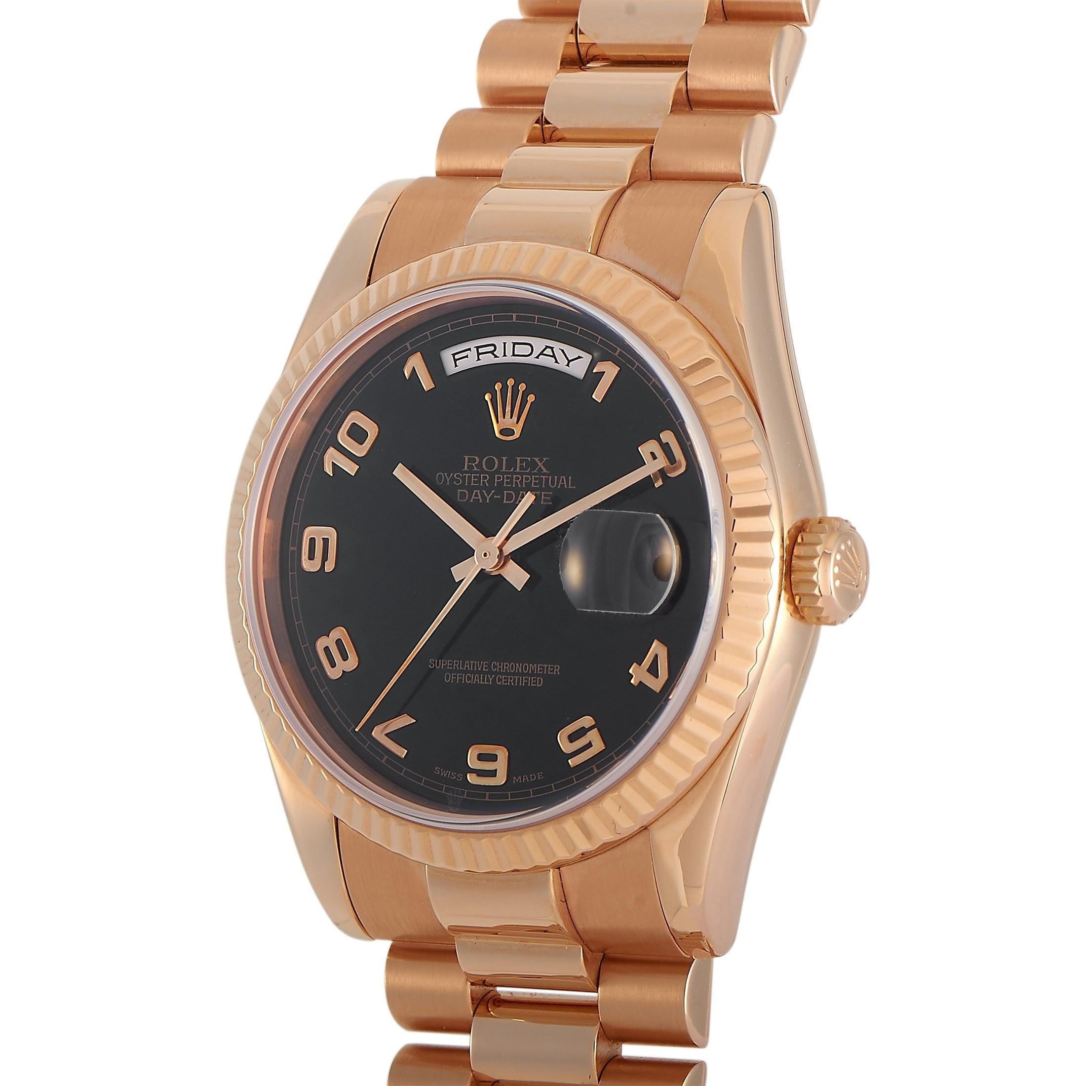 The Rolex President Day-Date Watch, reference number 118235, is a storied timepiece with an opulent aesthetic.

On this luxury piece, you’ll find a 36mm case, fluted bezel, and bracelet crafted from lustrous 18K Rose Gold. This material contrasts