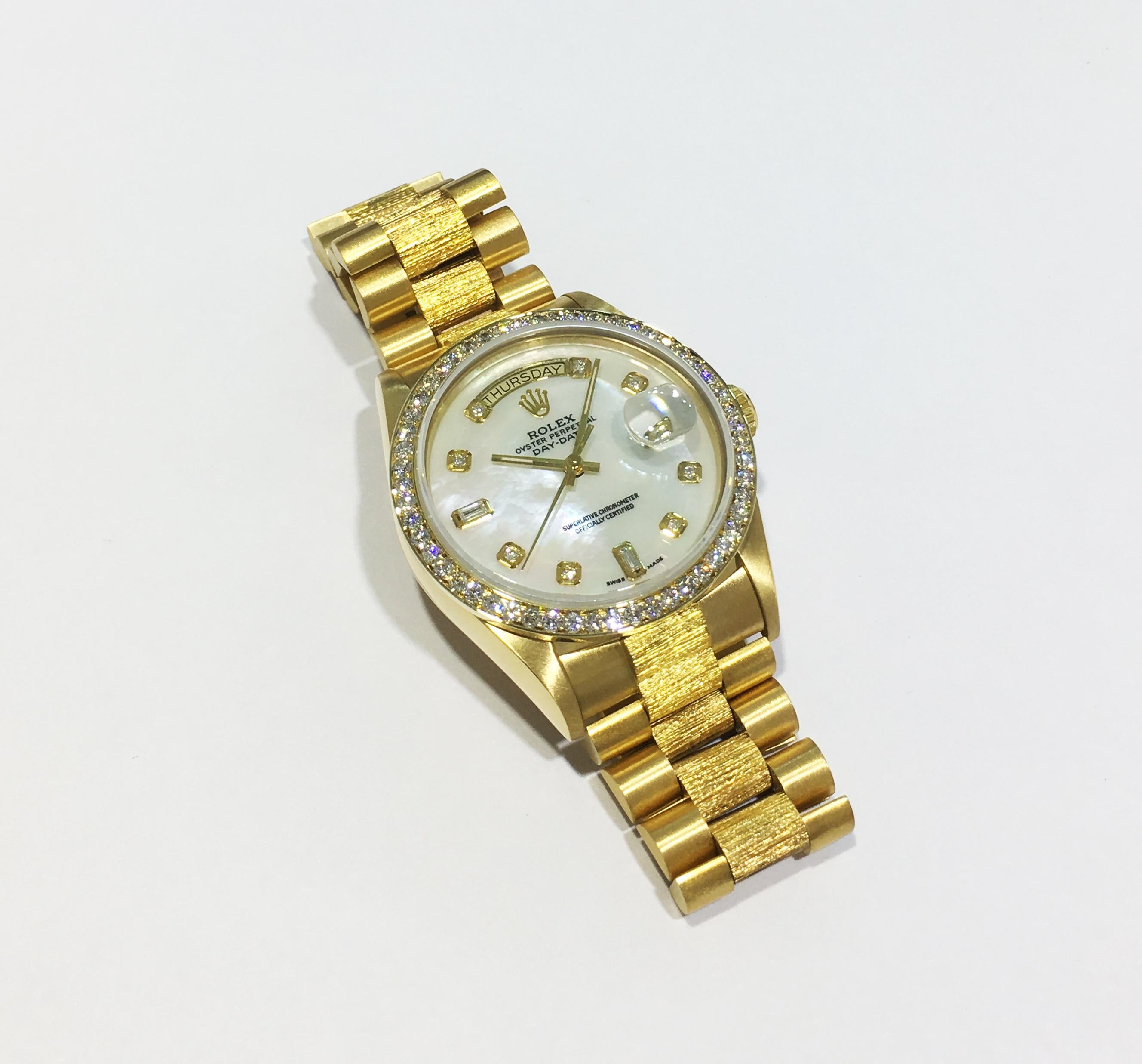 -Movement: Swiss Automatic
-Case Material: Solid 18k Yellow Gold
-Case Size: 36mm
-Bezel: Custom Aftermarket Diamond Bezel VS-G 2.0ct.
-Dial: Mother of Pearl Diamond Dial
-Bracelet: Solid 18k Yellow Gold Presidential Bark Edition
-Clasp: Solid 18k