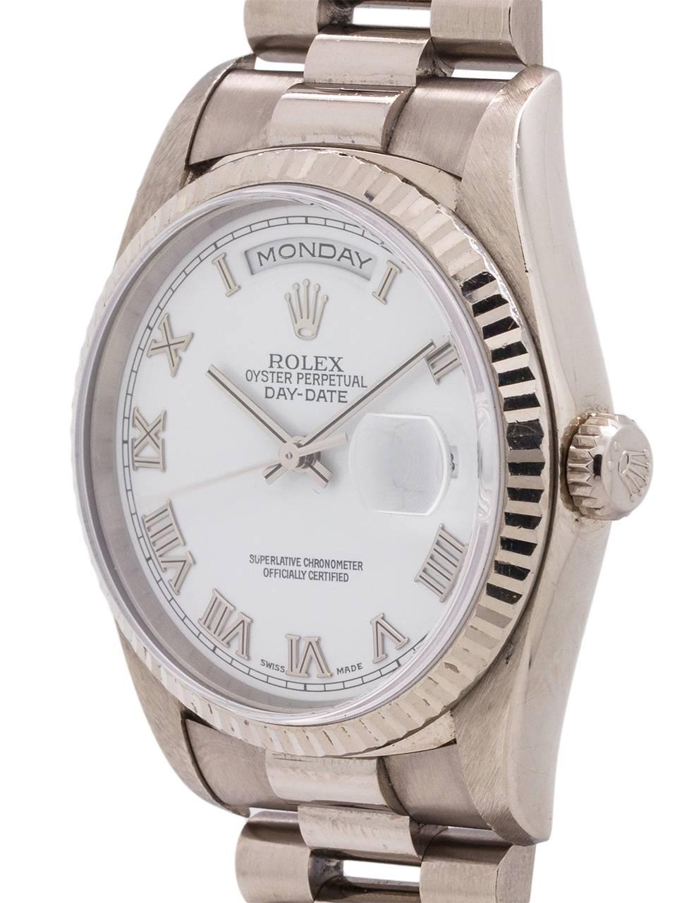 
Rolex 18K WG Day Date “double quick” President ref# 18239, A serial # circa 1998. Featuring a 36mm diameter case with fluted bezel, sapphire crystal, and beautiful original gloss white heavy Roman dial with applied silver indexes with black enamel
