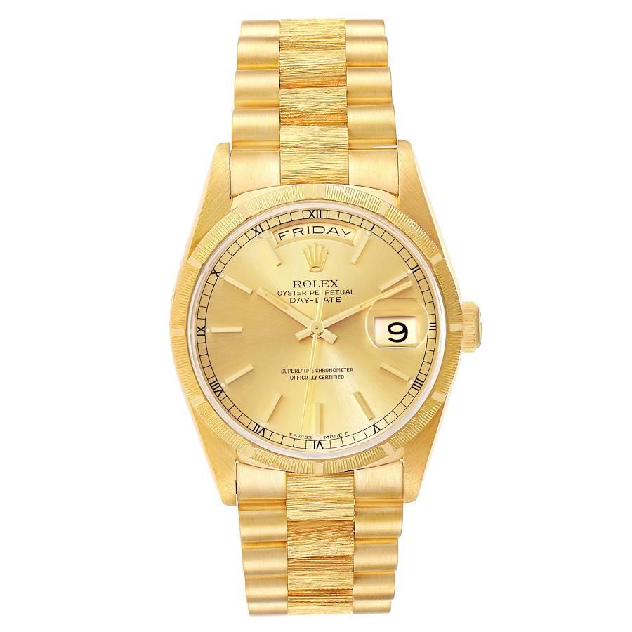 Rolex Day-Date President Yellow Gold Bark Finish Mens Watch 18248. Officially certified chronometer self-winding movement. 18k yellow gold oyster case 36 mm in diameter.  Rolex logo on a crown. 18k yellow gold bark finish bezel. Scratch resistant