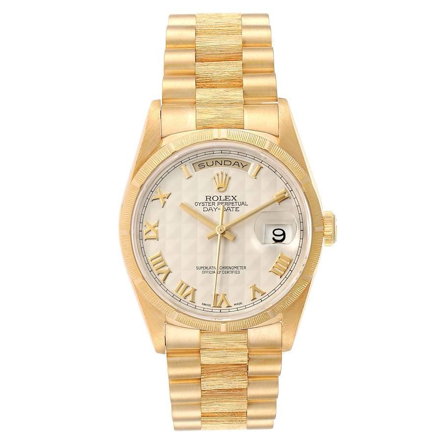 Rolex Day-Date President Yellow Gold Silver Pyramid Dial Mens Watch 18248 Box. Officially certified chronometer self-winding movement. 18k yellow gold oyster case 36 mm in diameter. Rolex logo on a crown. 18k yellow gold bark finish bezel. Scratch