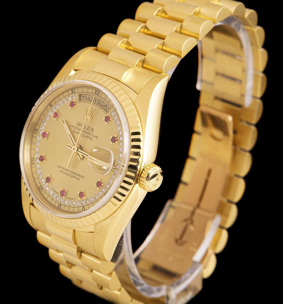 A Rare 36mm 1993 18k Yellow Gold Oyster Perpetual Day-Date Gents Wristwatch, champagne dial with a string of approximately 51 applied round brilliant cut diamonds and 10 applied ruby hour markers, day aperture at 12 0'clock, date aperture at 3
