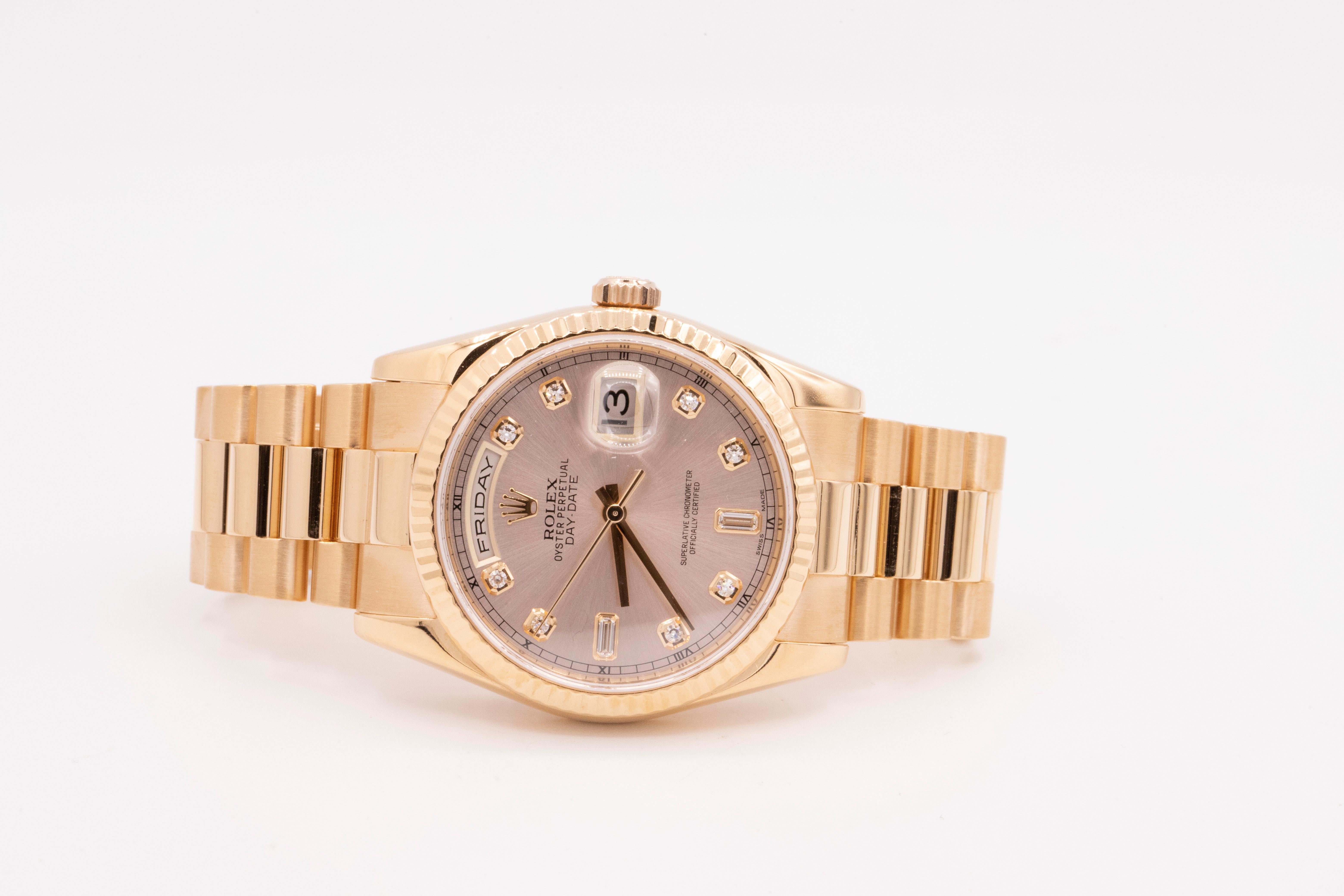 18kt Rose Gold Day-Date size 36mm. Champagne diamond dial with a fluted bezel and a president bracelet. Classic Day-Date style. The date is at 3 o'clock position and the day is at the 12 o'clock position. Circa 2002. No Box or Paperwork. 
