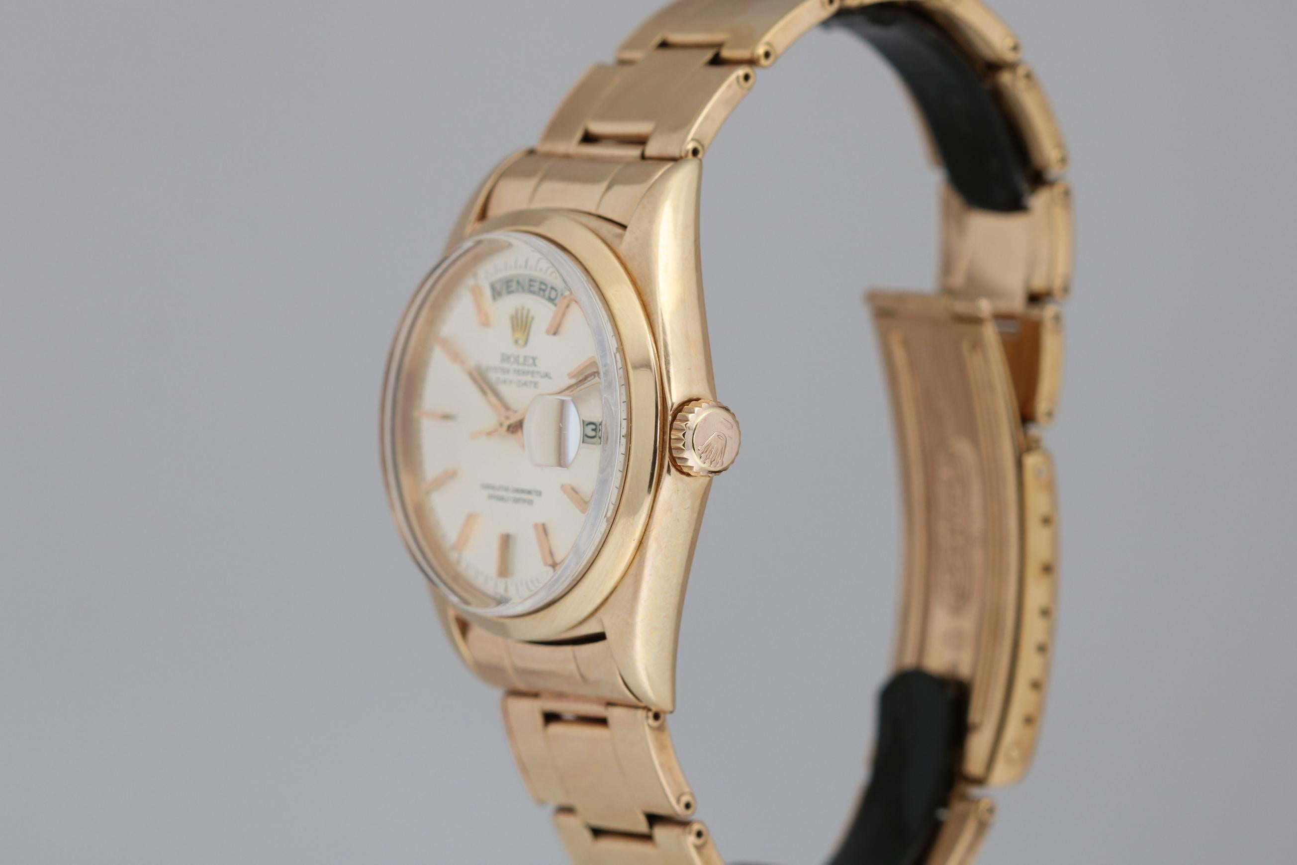 This is a Rolex 18kt  rose gold Day-Date reference 1802. This Day-Date reference is very special because it has a smooth bezel. It is a very rare reference and very desirable. This is a classic Rolex in excellent condition with a silver dial,