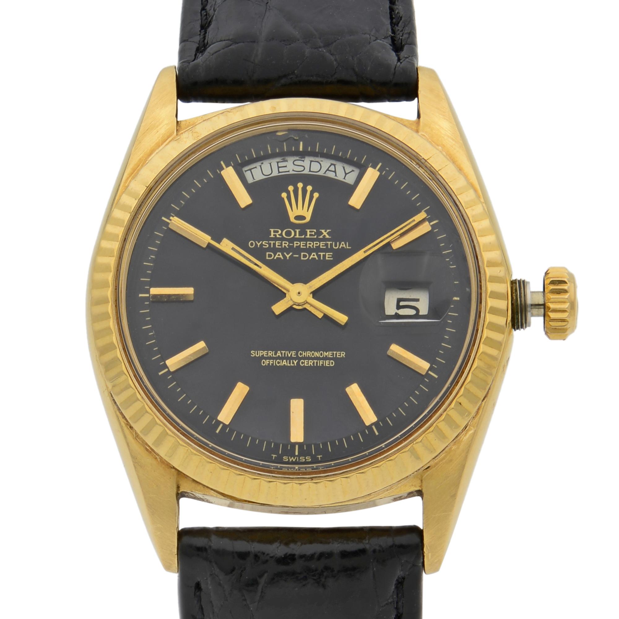This pre-owned Rolex Day Date 1803 is a beautiful men's timepiece that is powered by mechanical (automatic) movement which is cased in a yellow gold case. It has a round shape face, day & date dial and has hand sticks style markers. It is completed