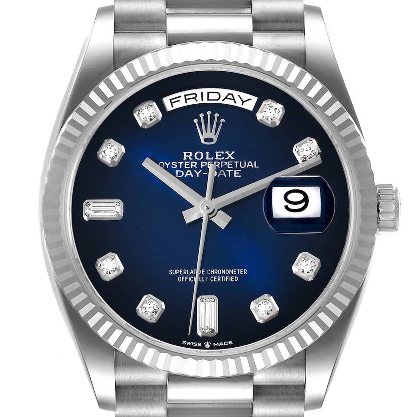 The Oyster Perpetual Day-Date 36 in 18 Ct White Gold with a Blue Ombré, Diamond-Set Dial, Fluted Bezel, and a President Bracelet. The Day-Date was the first watch to indicate the day of the week spelled out in full when it was first presented in