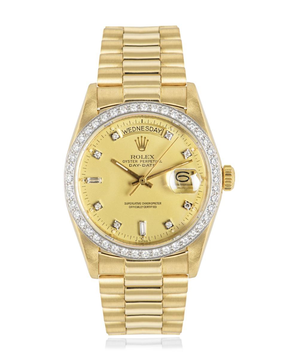 A yellow gold 36mm Day-Date by Rolex, featuring a champagne dial with 2 baguette cut and 8 round brilliant cut diamond hour markers. Complimenting the dial is the bezel set with round brilliant cut diamonds.

The president bracelet and concealed