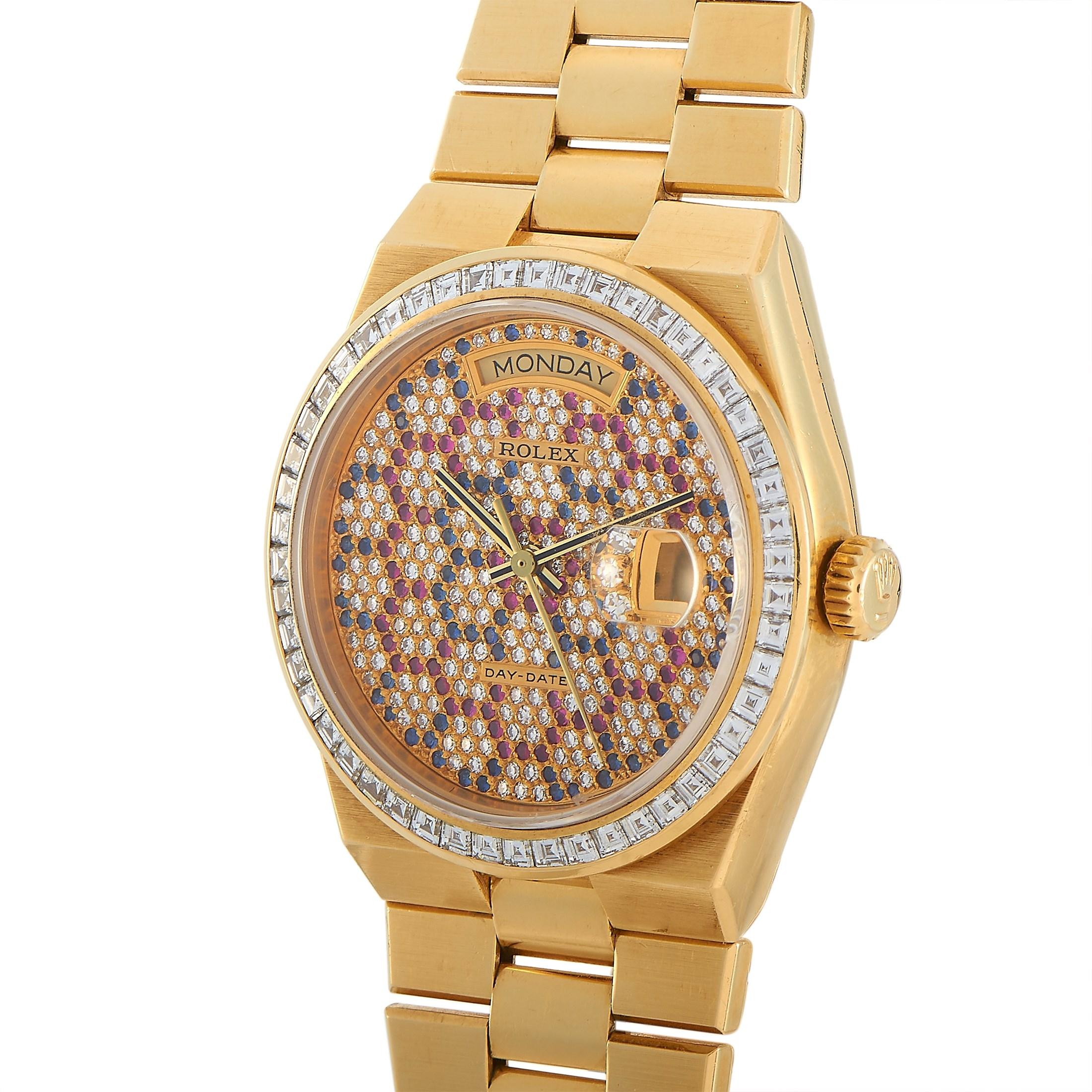 This bejeweled Rolex Day-Date Yellow Gold Honeycomb Dial Watch 18048, circa 1984, is a rare timepiece. On its 36mm case is a glittering dial with a honeycomb pattern. Each hexagon silhouette is lined with either rubies or sapphires, with the center