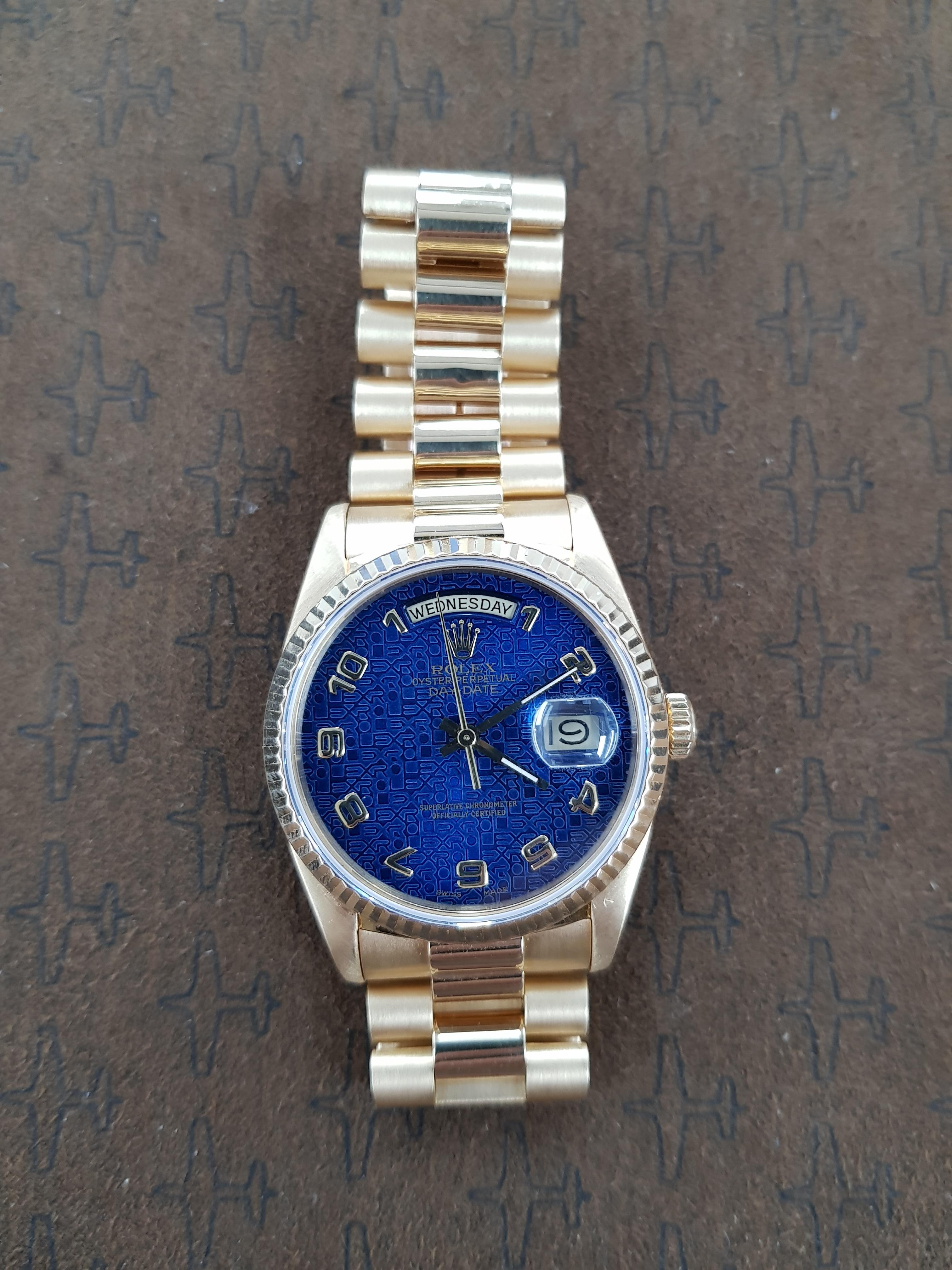 A highly collectable 36 mm blue dial Rolex Day Date in yellow gold.