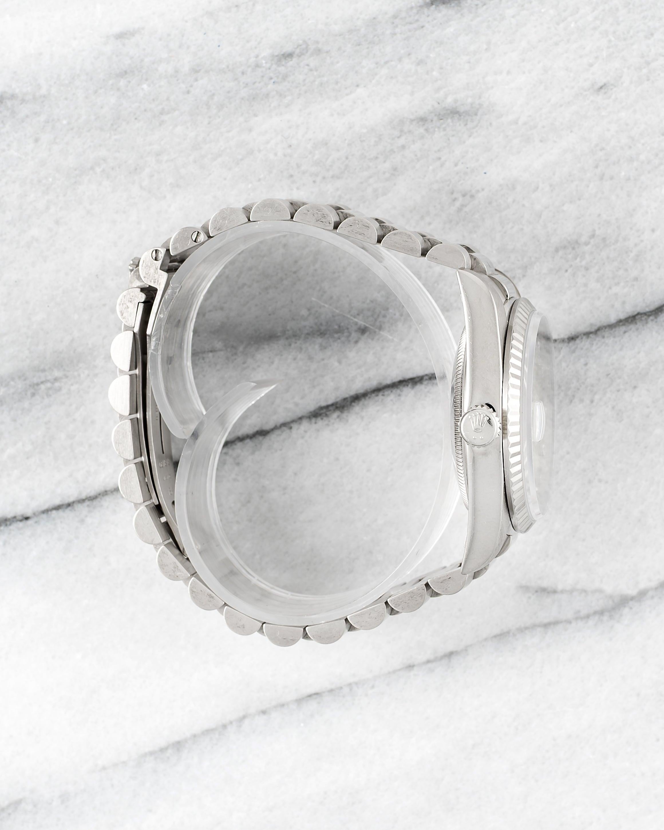 Here's a vintage Daydate reference 18239 with a factory silver diamond dial from the 1990s. Keeps great time and is fully functional. Measurements include a 36mm oyster case and 20mm lug width. It's on an original presidential bracelet that fits up