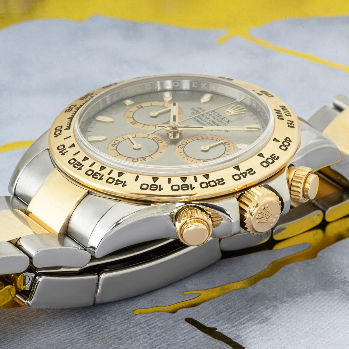 A Cosmograph Daytona by Rolex in Oystersteel and yellow gold. Featuring a grey dial with applied hour markers and an engraved tachymetric scale, three counters and pushers; the Daytona was designed to be the ultimate timing tool for endurance racing