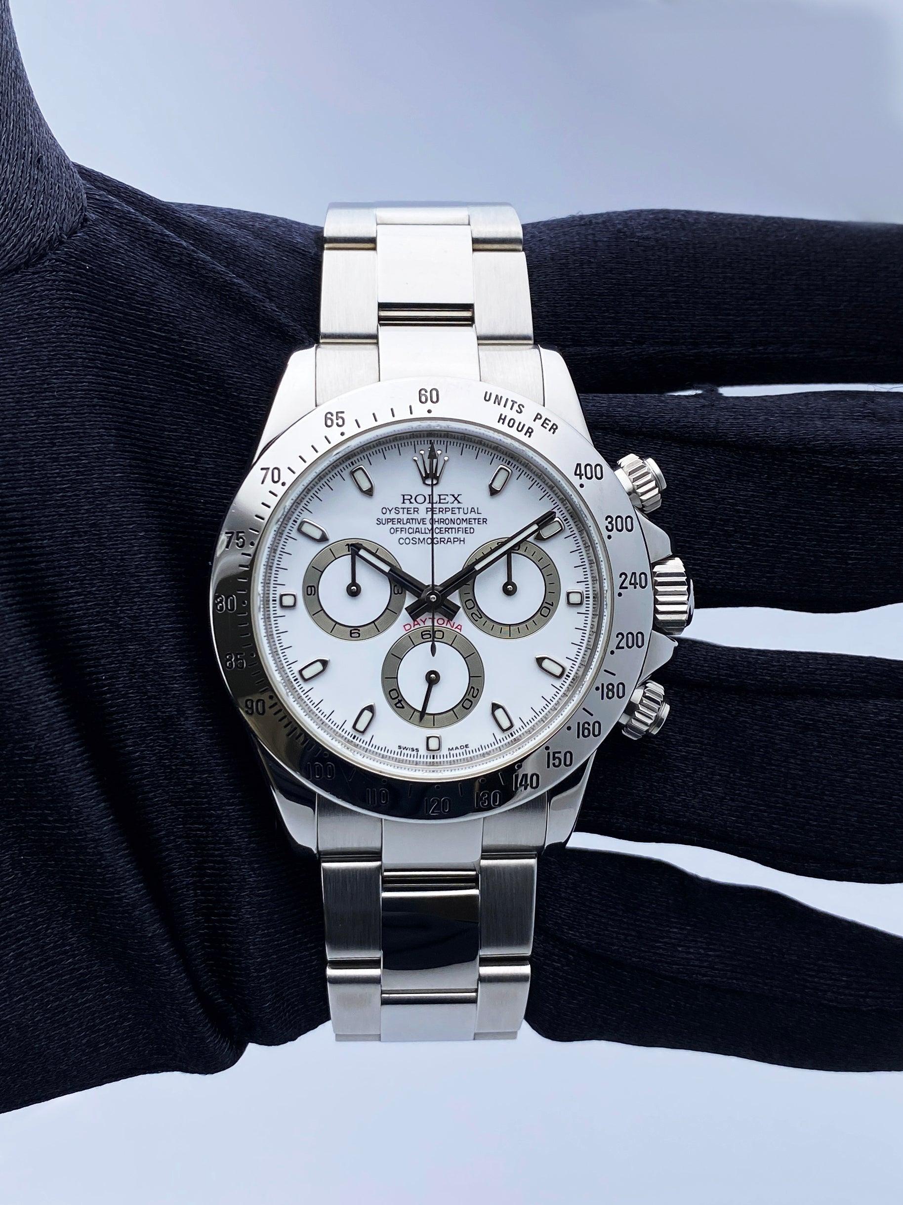 Rolex Oyster Perpetual Daytona 116520 Mens Watch. 40mm stainless steel case with stainless steel tachymeter bezel. White dial with luminous sliver hands and index hour marker. Three sub-dials. Small seconds hand at 6 o'clock. 30-minute counter at 3