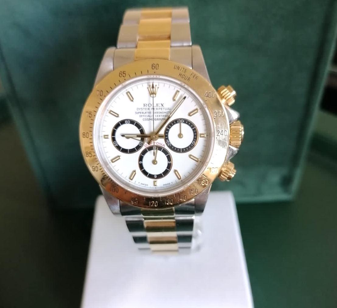 This 40 mm Rolex Daytona Chronograph Oystersteel and Yellow Gold Wristwatch, is the ultimate timing tool.

With its three counters and its pushers, this chronograph allows the driver to measure elapsed time, which is displayed in hours, minutes and