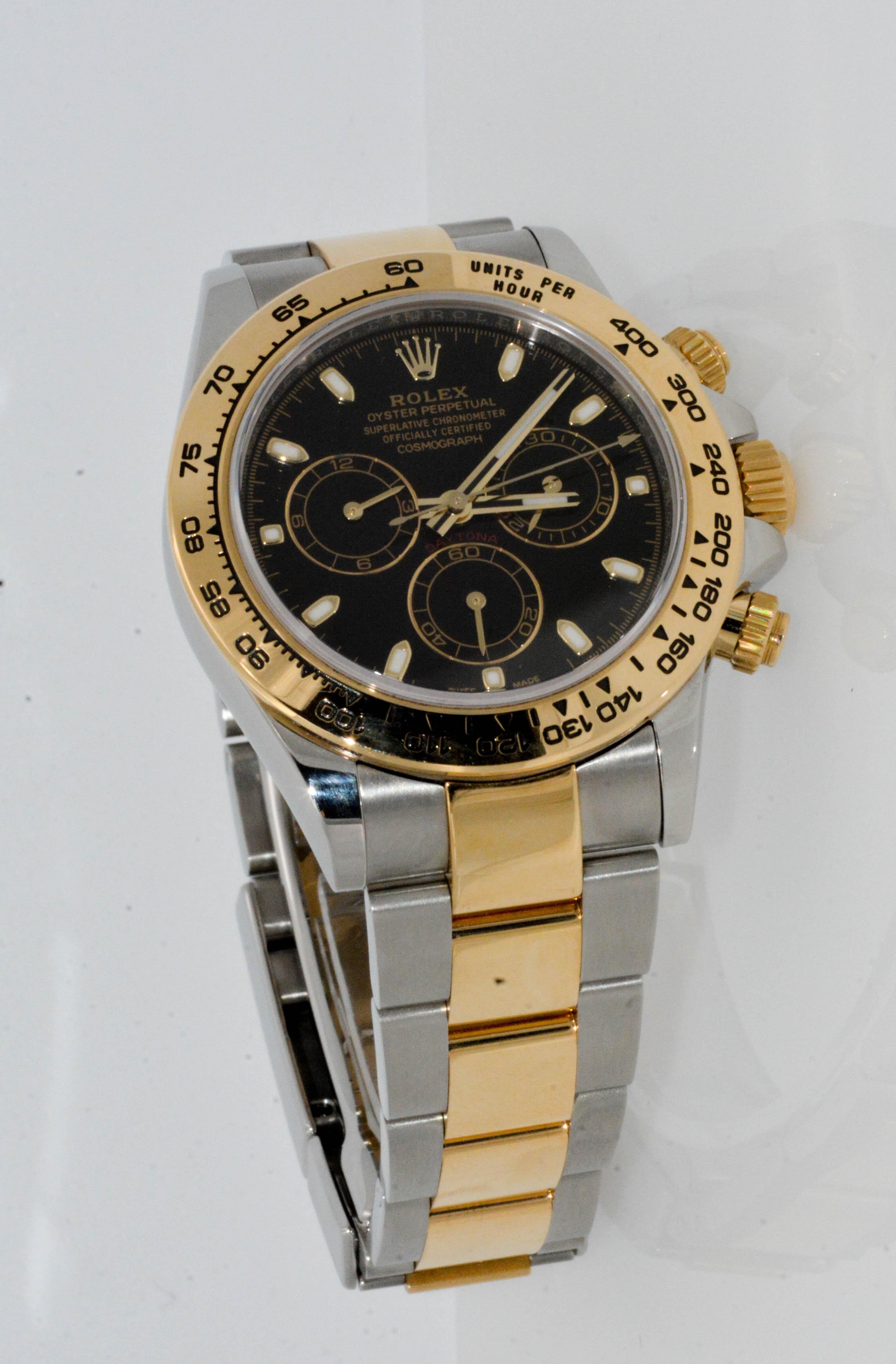 Stainless Steel and 18 karat yellow gold ROLEX Daytona Cosmo, Oyster Perpetual, Superlative Chronometer, Officially Certified Cosmograph watch. 40 mm. Black dial. Model 11650303304.