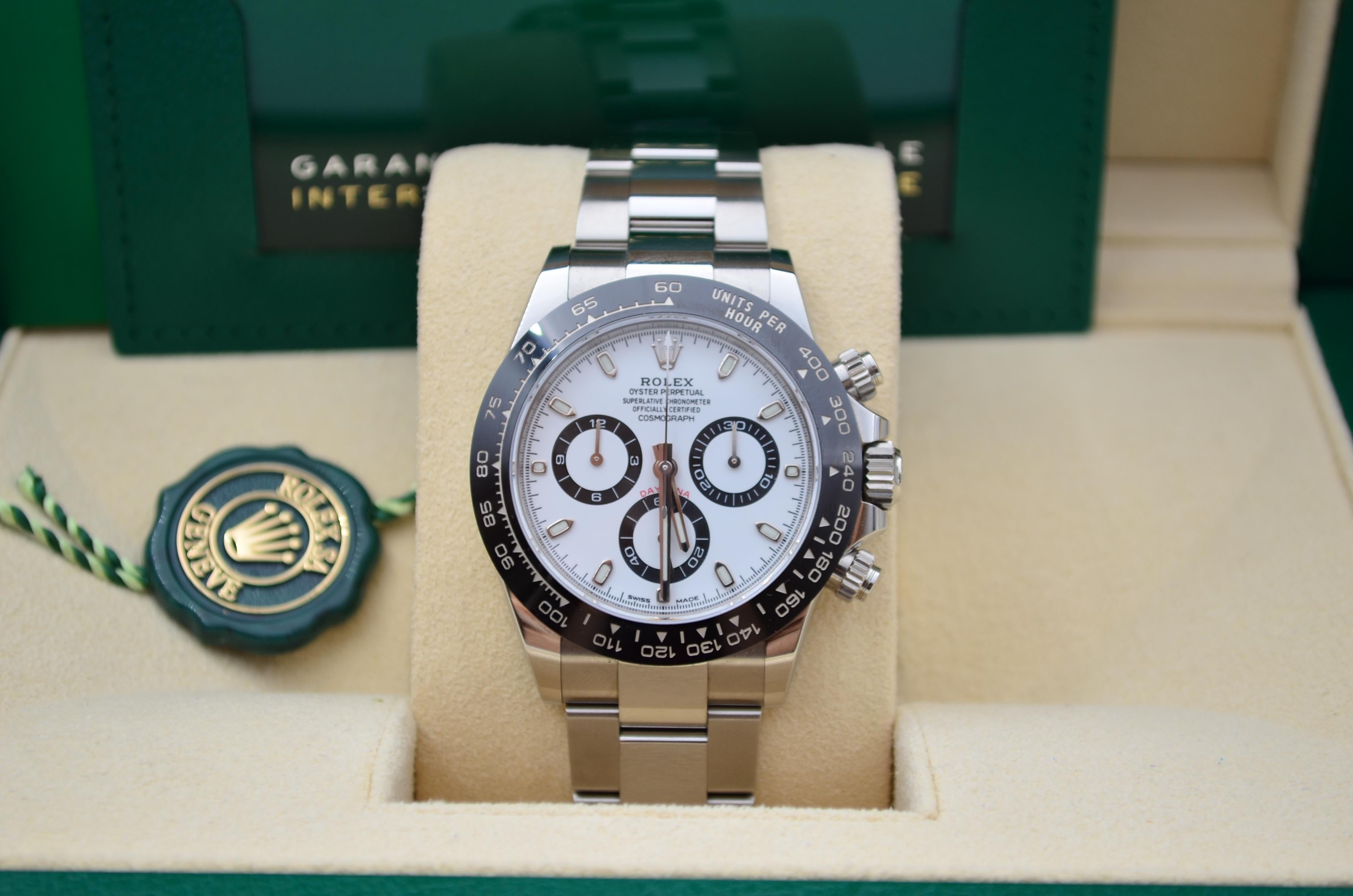 The Rolex Daytona Cosmograph Panda 40mm with a full set from 2020, made of steel and referenced as 116500LN, is a highly sought-after and iconic luxury watch known for its association with motorsports.  This watch has a 40mm case size. This size is