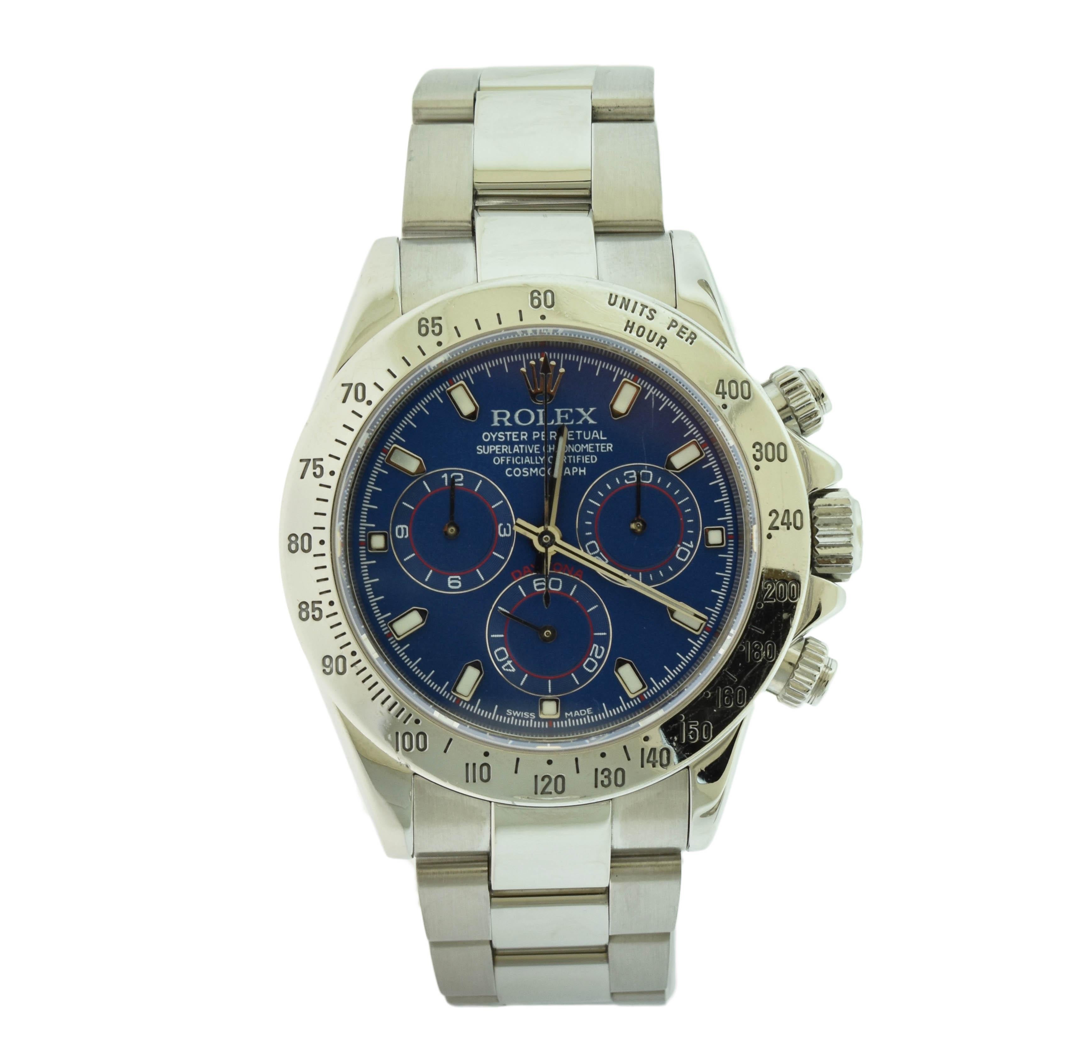 Brand: Rolex

Model Name: Daytona

Model Number: 116520

Movement: Automatic

Case Size: 40 mm

Case Material: Stainless Steel 

Dial: Blue Dial (After market)

Bezel: Engraved Tachymetric Scale

Hour Markers: Stick Hour Markers

Bracelet: Stainless