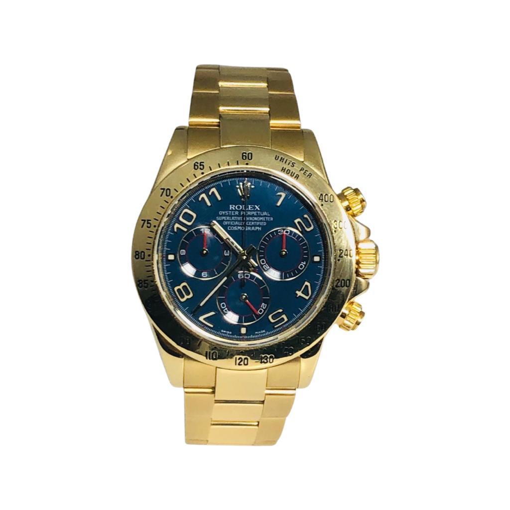 Brand: Rolex

Model Name: Daytona

Reference: 116528

Metal: 18k Yellow Gold

Case Size: 40 mm

Case Back: Closed

Strap: 18k Yellow Gold

Dial: Blue

Hour Markers: Arabic Numerals

Features: Hours, Minutes, Seconds, Chronograph,

Includes: 24 Month