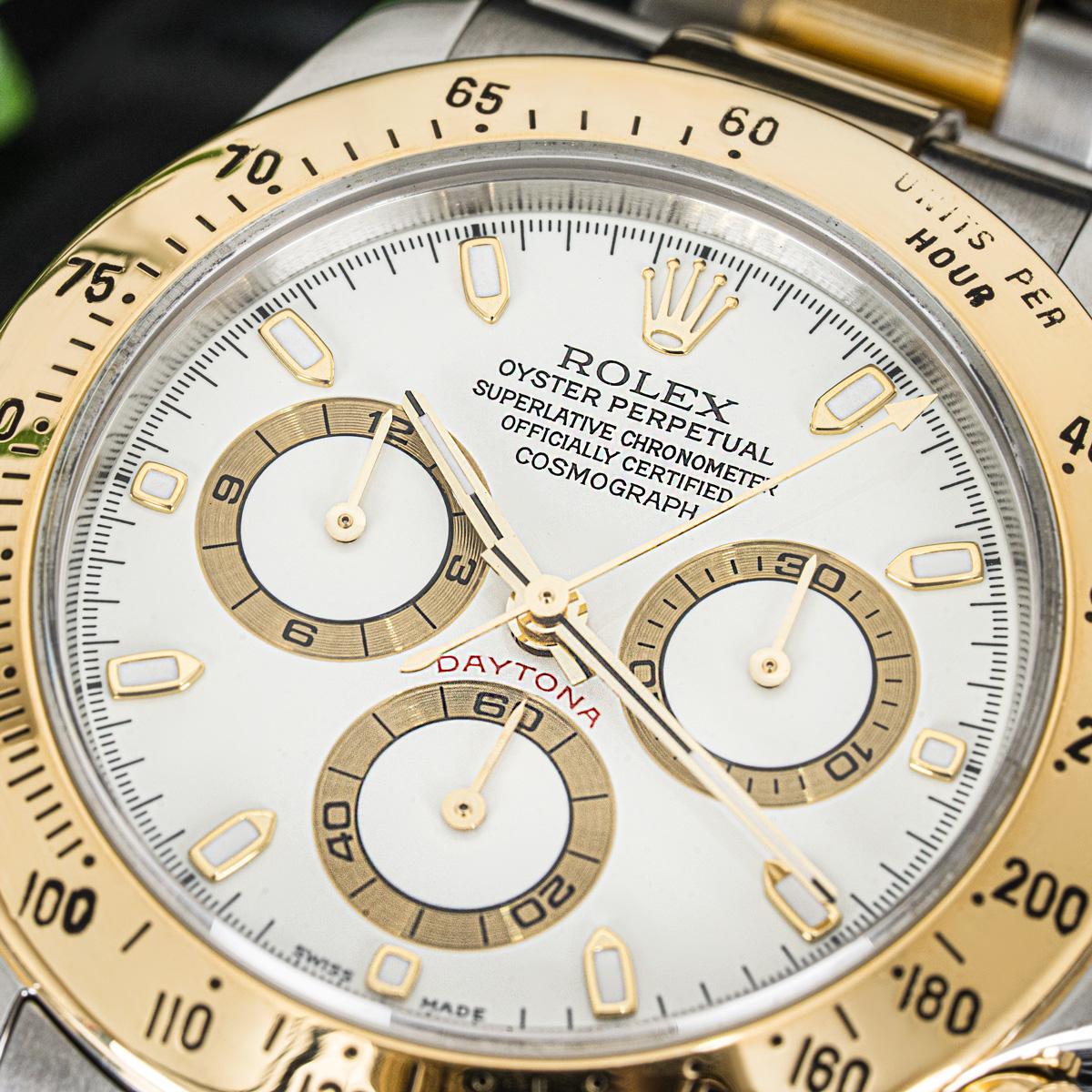 A Daytona in Oystersteel and yellow gold by Rolex. Featuring a distinctive cream dial with an engraved tachymetric scale, three chronograph counters and pushers; the Daytona was designed to be the ultimate timing tool for endurance racing