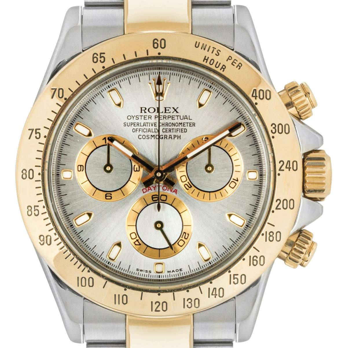 A Daytona in Oystersteel and yellow gold by Rolex. Featuring a distinctive grey dial with an engraved tachymetric scale, three chronograph counters and pushers, the Daytona was designed to be the ultimate timing tool for endurance racing
