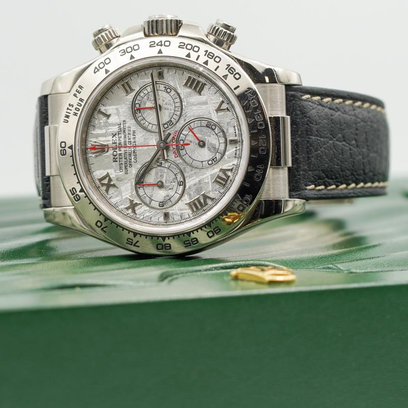 This Rolex Daytona was recently traded in to our store and is in very good condition. The highlight of the watch is its dial, made of Gibeon Meteorite. Rolex was the first watch manufacturer to use meteorite in their dials. The watch case is made of