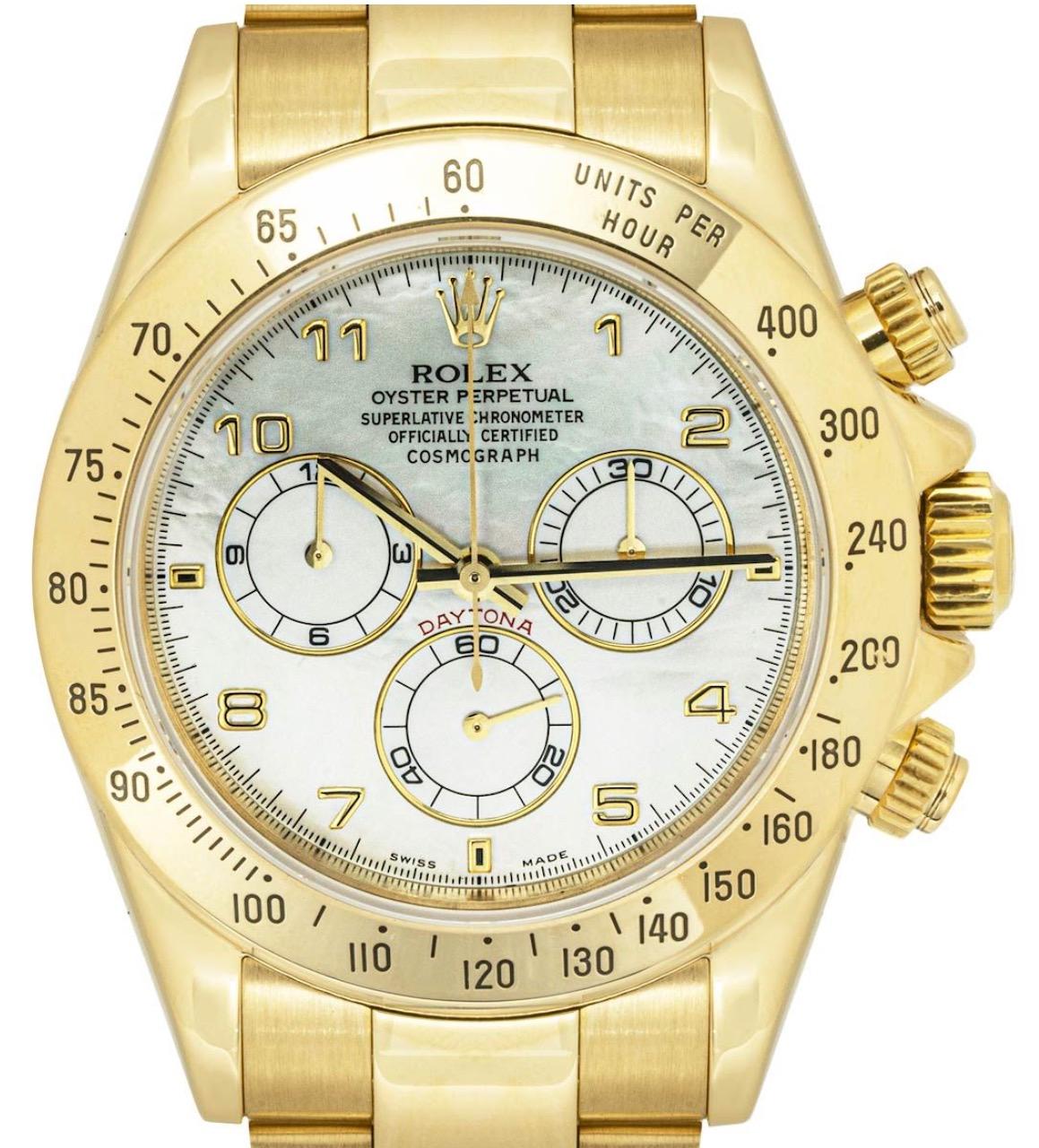 An 18k yellow gold Cosmograph Daytona wristwatch by Rolex. Features a striking mother of pearl dial with applied arabic house markers, a 30 minute recorder, a small seconds, a 12-hour recorder and a yellow gold bezel with an engraved