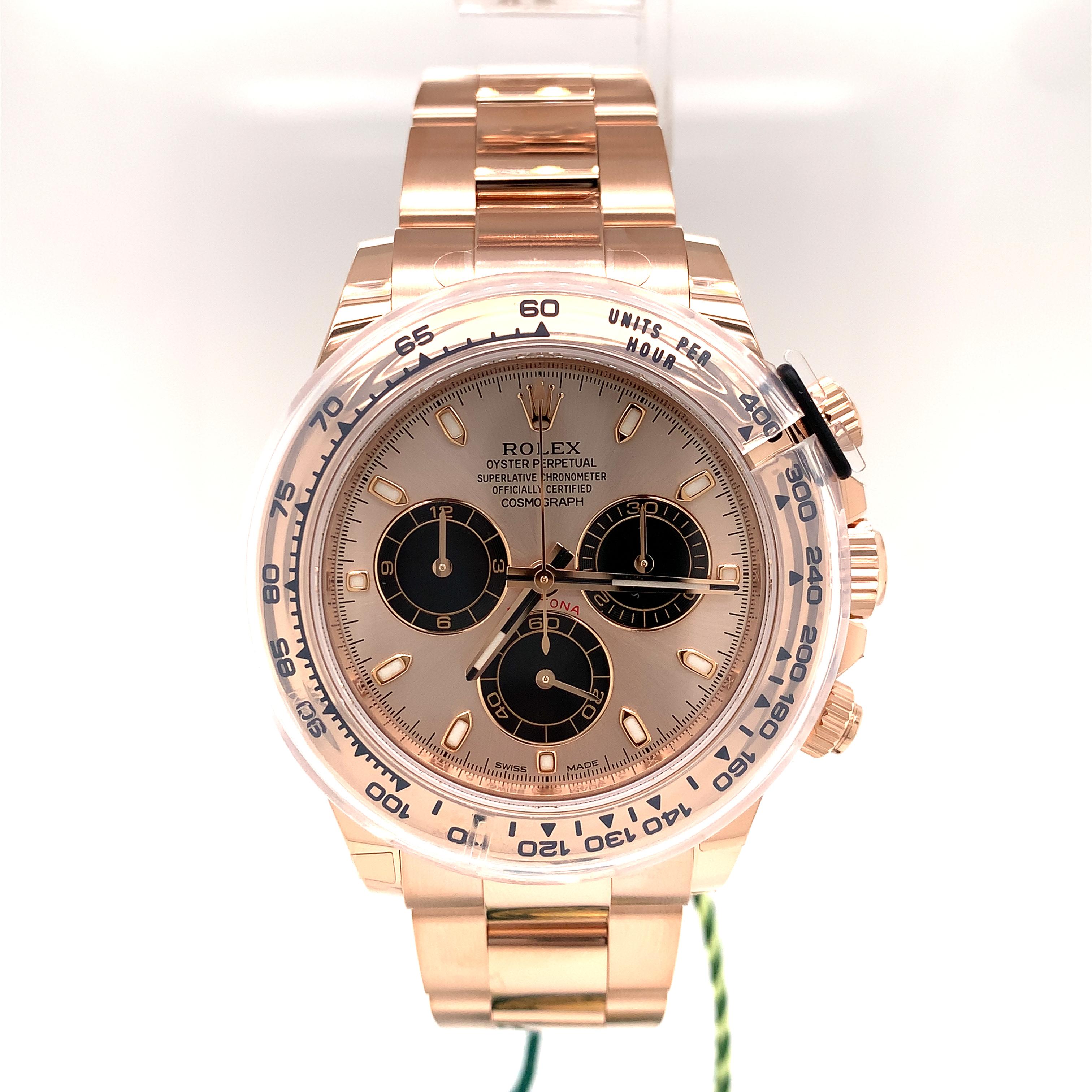 This Rolex Oyster Perpetual Cosmograph Daytona in 18 ct rose gold, with white mother-of-pearl, diamond-set dial, and an Oyster bracelet, features an 18 ct rose gold bezel with engraved tachymetric scale. This chronograph was designed to be the