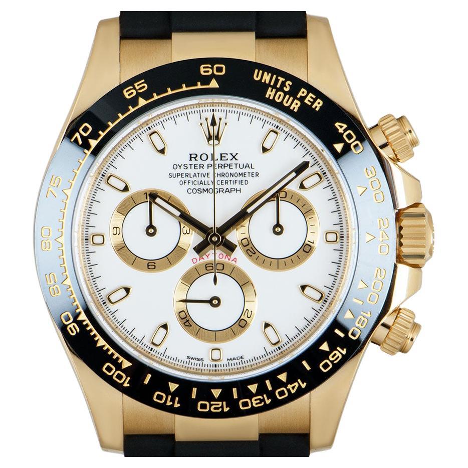 An unworn yellow gold Cosmograph Daytona from Rolex, features a white dial with snailed small counters. Featuring a black ceramic bezel with a moulded tachymetric scale, the three chronograph counters and pushers, this high performance chronograph