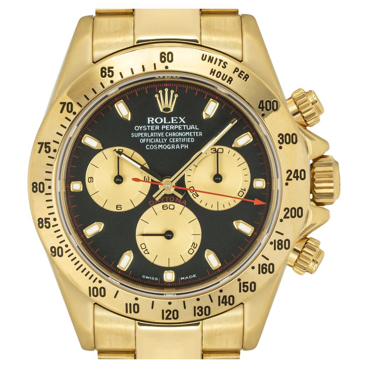 A yellow gold Cosmograph Daytona by Rolex. Featuring a Paul Newman black dial with contrasting outer minute track and champagne sub-dials as well as a yellow gold tachymeter bezel.

Fitted with a sapphire glass, a self-winding Cosmograph movement