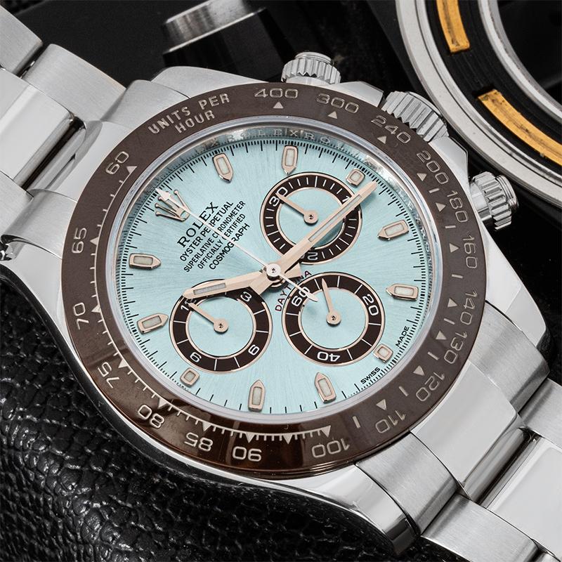 A 40mm Daytona crafted in platinum by Rolex. Featuring an ice blue dial which is the exclusive signature of a Rolex platinum watch. With its engraved tachymetric scale on the chestnut brown ceramic bezel, three snailed small counters and pushers,