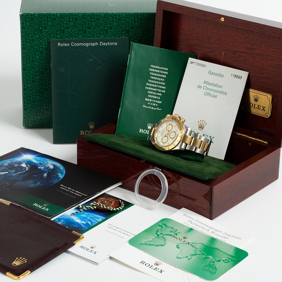 Our Rolex Daytona reference 116523 features a stainless steel and 18k yellow gold case with Oyster bracelet with Oysterlock clasp with rapid adjustment feature and desirable white baton dial. This is a superb example, presented in outstanding