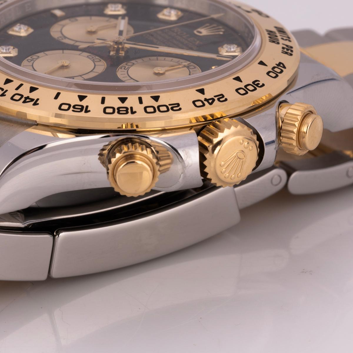 An unworn Daytona from Rolex in Oystersteel and yellow gold. Features the bright black and golden diamond-set dial. With an engraved tachymetric scale, three counters, and pushers, the Daytona was designed to be the ultimate timing tool for