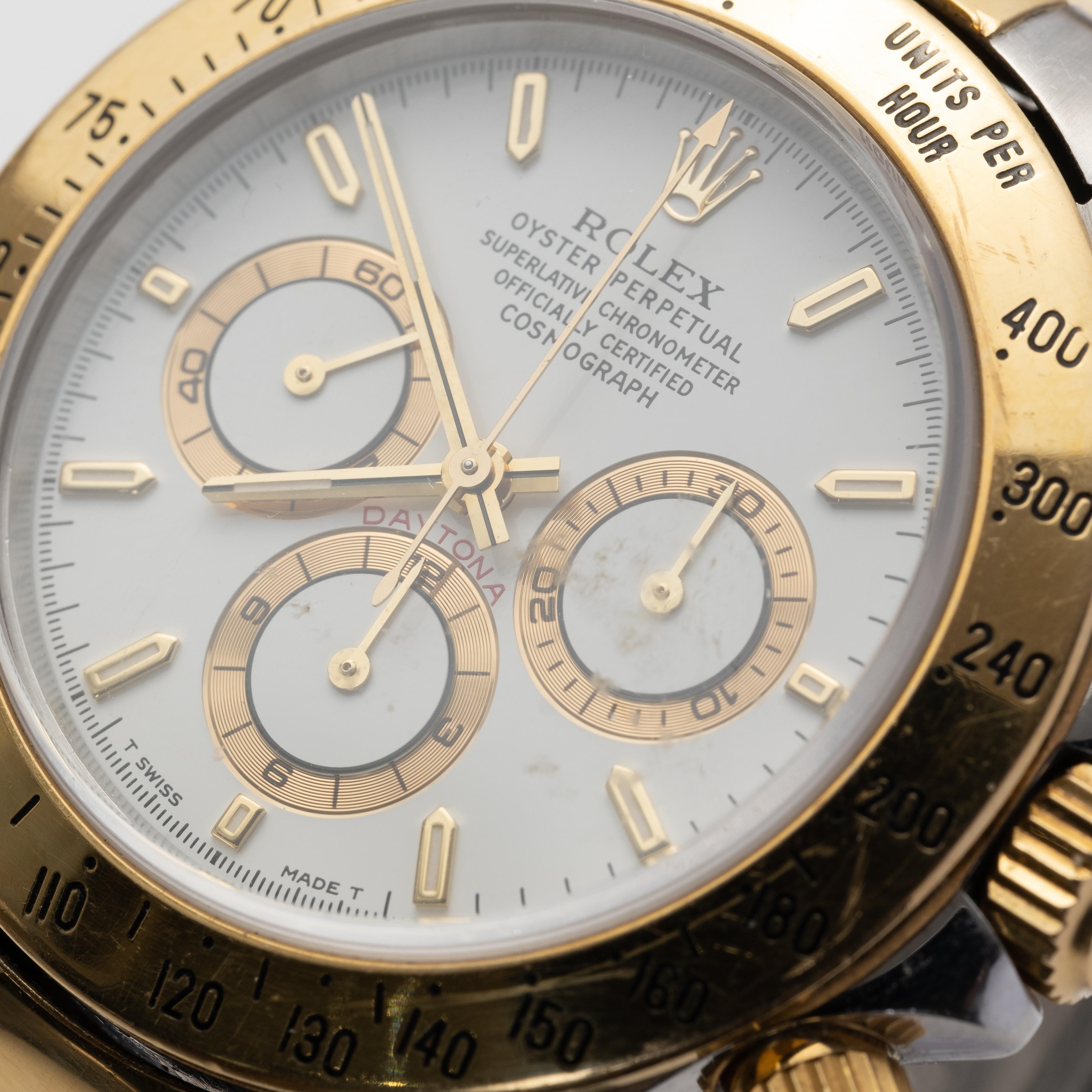 Rolex Two-tone Chronograph Daytona Reference 16523 Wristwatch with Box and Papers, c. 1997, white dial with three subsidiary dials, engraved gold tachometer bezel, screw-down crown and pushers, 31-jewel caliber 4030 automatic movement, case back