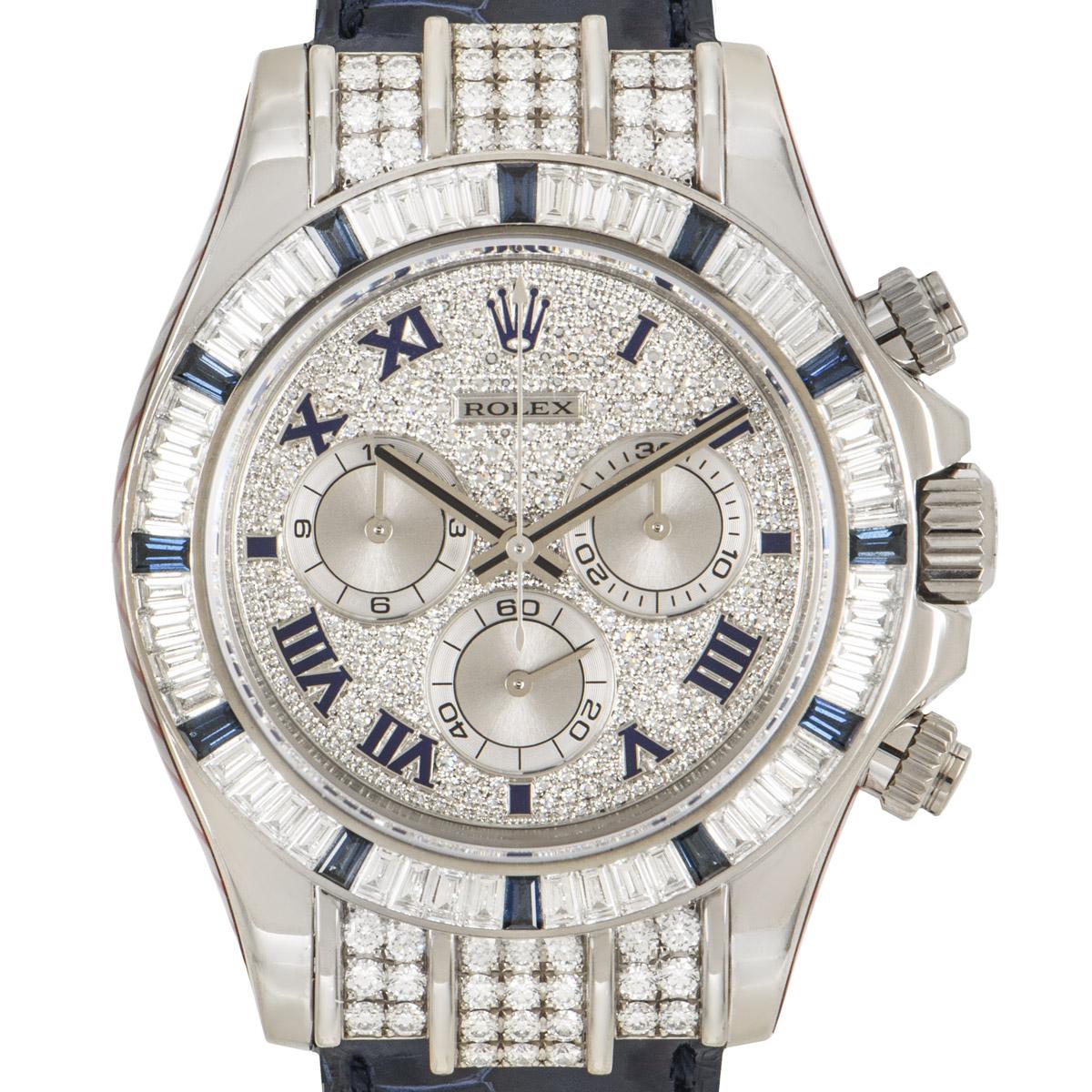 A stunning diamond and sapphire set Daytona crafted in white gold by Rolex. Features a pave diamond dial with roman applied numerals, 3 sub dials featuring a 30 minute and 12 hour recorder as well as a small seconds. Complimenting the dial is a