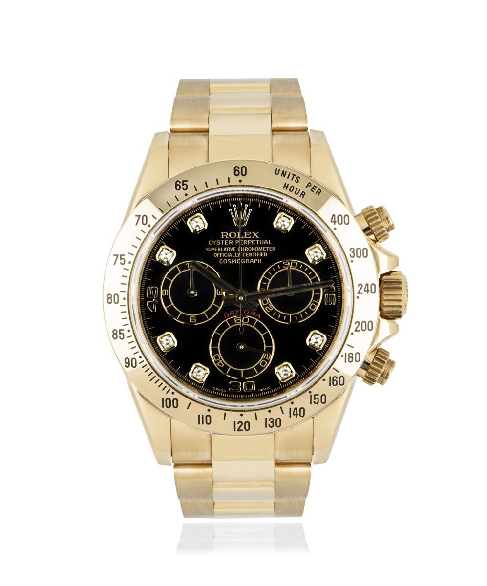 A 40mm Daytona in yellow gold by Rolex, with a black dial that's set with 8 round brilliant cut diamond hour markers. Featuring a tachymetric scale, three counters and pushers, specially designed to be the ultimate timing tool for endurance racing