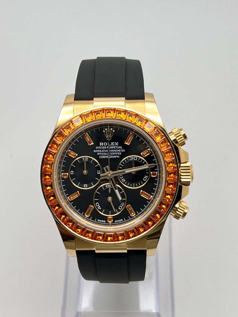 Rolex Daytona Yellow Gold Orange Sapphire Bezel Black Diamond Dial