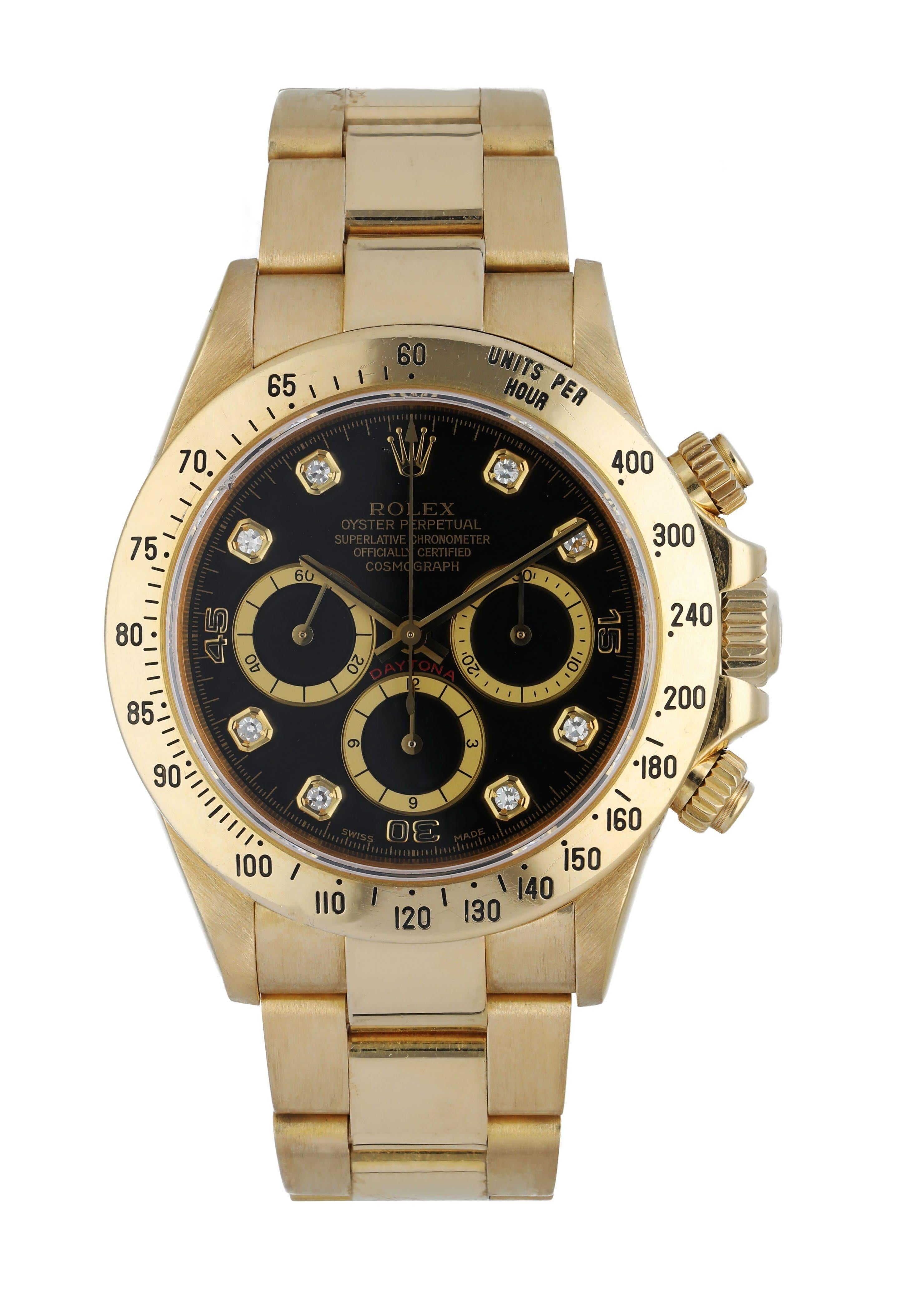 Rolex Daytona  Zenith 16528 Men's Watch. 
40mm 18k Yellow gold case. 
Yellow Gold Tachymeter bezel. 
Black dial with gold hands and factory set diamond hour markers. 
Minute markers on the outer dial. 
Yellow Gold Bracelet with Fold Over Clasp With