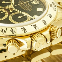Rolex Daytona Zenith Yellow Gold Black Diamond Dial NOS 16528