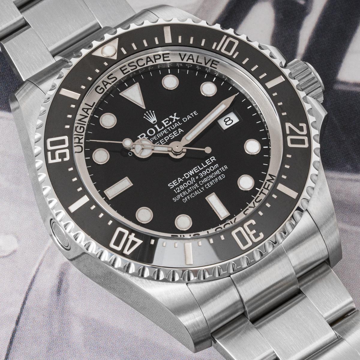A Deepsea Sea-Dweller in Oystersteel by Rolex. Featuring a black dial covered by a domed scratch-resistant sapphire crystal. The black ceramic unidirectional rotatable bezel has 60 minute graduations coated in platinum. Features an Oyster bracelet