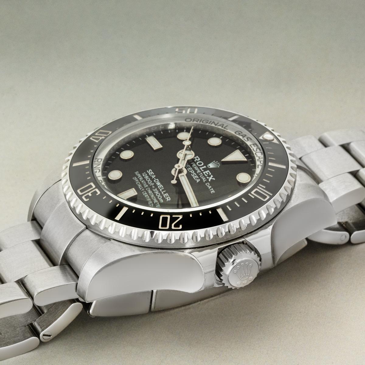 The 136660 Deepsea Sea-Dweller in Oystersteel by Rolex. Featuring an intense black dial under a domed scratch-resistant sapphire crystal. The stainless steel uni-directional rotatable bezel features a black ceramic insert with platinum coated