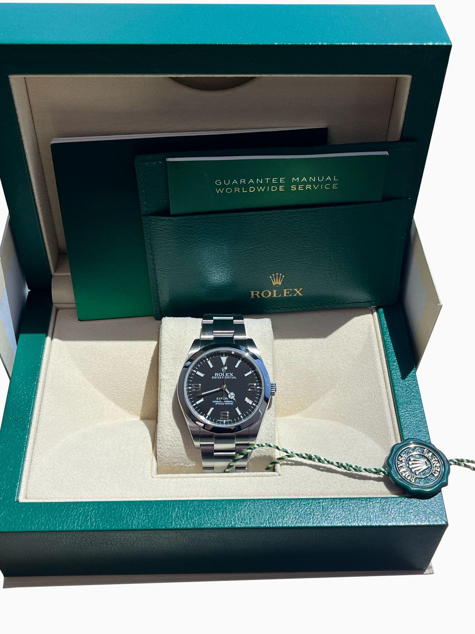 Rolex Explorer I 39mm Black Dial Steel Mens Watch 214270. Officially certified chronometer automatic self-winding movement. Stainless steel oyster case 39.0 mm in diameter. Rolex logo on the crown. Stainless steel smooth bezel. Scratch-resistant