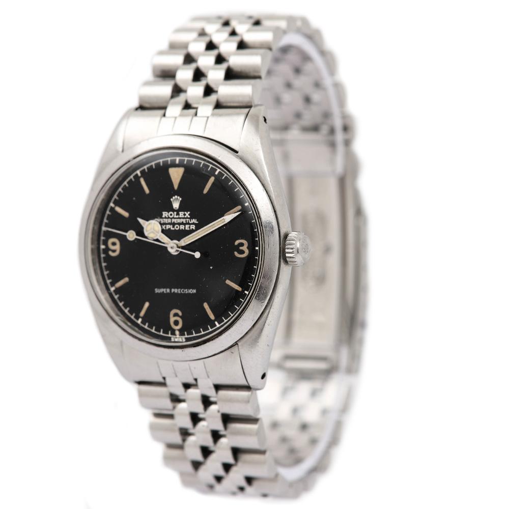 A rare, stainless steel Rolex Oyster Perpetual Super Precision Explorer vintage gents wristwatch ref. 5504. A timeless, original black gilt dial with applied hour markers and Arabic numbers 3, 6 and 9, a fixed stainless steel smooth bezel, a