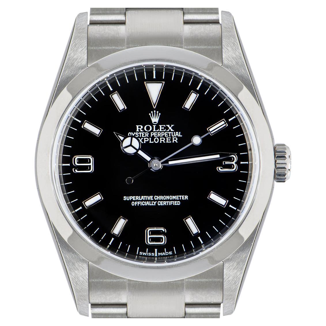 An unworn NOS 36mm Explorer I in Oystersteel by Rolex. Features a black dial and the iconic smooth bezel. The Oyster bracelet comes equipped with a folding Oysterlock clasp. Fitted with scratch-resistant sapphire crystal and a self-winding automatic